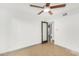 Bright bedroom with sliding door, ceiling fan, and built-in closet at 3033 E Sierra St, Phoenix, AZ 85028