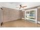 Spare bedroom with concrete floors and sliding door access to backyard at 3033 E Sierra St, Phoenix, AZ 85028