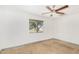 Spacious bedroom with window and ceiling fan at 3033 E Sierra St, Phoenix, AZ 85028