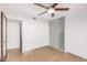 Bright bedroom with sliding door, ceiling fan, and built-in closet at 3033 E Sierra St, Phoenix, AZ 85028
