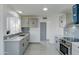 Modern kitchen with gray cabinets, quartz countertops, and stainless steel appliances at 8319 W Mclellan Rd, Glendale, AZ 85305