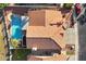 Top-down view of home showcasing tile roof and pool at 19537 N 69Th Ave, Glendale, AZ 85308