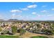 Aerial view of a residential neighborhood with golf course and mountain views at 19537 N 69Th Ave, Glendale, AZ 85308