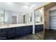Bathroom with double vanity and large mirror at 19537 N 69Th Ave, Glendale, AZ 85308