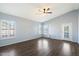 Bedroom with wood-look flooring, ceiling fan and private balcony at 19537 N 69Th Ave, Glendale, AZ 85308