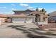 Two-story house with three-car garage and landscaped front yard at 19537 N 69Th Ave, Glendale, AZ 85308