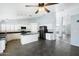 Kitchen with island, white cabinets, and black appliances at 19537 N 69Th Ave, Glendale, AZ 85308