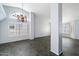 Bright living room featuring a stained-glass window and tile floors at 19537 N 69Th Ave, Glendale, AZ 85308