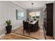 Elegant dining room with large wooden table, buffet, and chandelier at 31153 N 117Th Dr, Peoria, AZ 85383