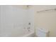 Bathroom with shower/tub combo and tile surround at 5138 W Fulton St, Phoenix, AZ 85043
