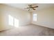 Bright bedroom with carpeted floor and ceiling fan at 5138 W Fulton St, Phoenix, AZ 85043
