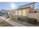 Tan two-story house with a walkway and landscaping at 5138 W Fulton St, Phoenix, AZ 85043
