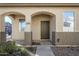 House entrance with arched entryway and dark brown door at 5138 W Fulton St, Phoenix, AZ 85043