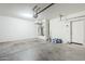 Garage with concrete floor and storage space at 5138 W Fulton St, Phoenix, AZ 85043
