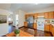 Kitchen with stainless steel appliances and view into living room at 5138 W Fulton St, Phoenix, AZ 85043