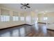 Open living room with hardwood floors, and staircase at 5138 W Fulton St, Phoenix, AZ 85043