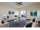 Spacious living room with hardwood floors, neutral colors, and patio access at 5138 W Fulton St, Phoenix, AZ 85043