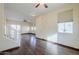 Bright living room with hardwood floors and a staircase at 5138 W Fulton St, Phoenix, AZ 85043