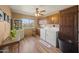 Laundry room with washer, dryer, and ample cabinet space at 1276 N Vulture Mine Rd, Wickenburg, AZ 85390