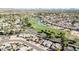 Aerial view of neighborhood near golf course with pond and fountain at 18903 N 97Th Ln, Peoria, AZ 85382