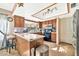 Well-equipped kitchen featuring wood cabinets and modern appliances at 18903 N 97Th Ln, Peoria, AZ 85382