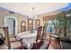 Bright dining room with wood table and chairs, ready for Gathering meals at 18903 N 97Th Ln, Peoria, AZ 85382