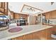 Bright kitchen with lots of counter space and wood cabinets at 18903 N 97Th Ln, Peoria, AZ 85382