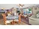 Casual dining area with round table and chairs, adjacent to living space at 18903 N 97Th Ln, Peoria, AZ 85382