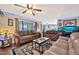 Living room with two sofas, coffee table, and large aquarium at 18903 N 97Th Ln, Peoria, AZ 85382
