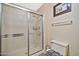 Clean bathroom with a shower stall and toilet at 18903 N 97Th Ln, Peoria, AZ 85382