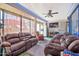 Bright and spacious sunroom with comfortable seating at 18903 N 97Th Ln, Peoria, AZ 85382