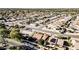 Aerial view of community featuring homes, landscaping, and a golf course at 18903 N 97Th Ln, Peoria, AZ 85382