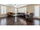 Comfortable living room with dark hardwood floors and a glass coffee table at 1663 S Boulder St, Gilbert, AZ 85295
