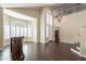Bright living room with hardwood floors and a view of the entryway and staircase at 1663 S Boulder St, Gilbert, AZ 85295