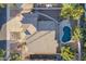 Aerial view showcasing the house, pool, and surrounding landscape at 1663 S Boulder St, Gilbert, AZ 85295