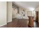 Open living room with hardwood floors, staircase, and a partial view of the dining room at 1663 S Boulder St, Gilbert, AZ 85295