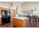 Kitchen with island, stainless steel appliances, and wood cabinets at 1663 S Boulder St, Gilbert, AZ 85295