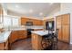 Spacious kitchen with island, updated countertops, and wood cabinets at 1663 S Boulder St, Gilbert, AZ 85295