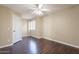 Bright bedroom with ceiling fan, wood flooring and window shutters at 1663 S Boulder St, Gilbert, AZ 85295