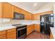 Modern kitchen with stainless steel appliances and wood cabinets at 1663 S Boulder St, Gilbert, AZ 85295