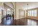Dining room with hardwood floors, arched doorways, and a view of the kitchen at 1663 S Boulder St, Gilbert, AZ 85295