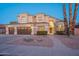 Two-story home with a three-car garage and landscaped front yard at 1663 S Boulder St, Gilbert, AZ 85295