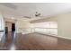 Loft area featuring hardwood floors, a ceiling fan, and access to other rooms at 1663 S Boulder St, Gilbert, AZ 85295
