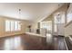 Spacious dining room with hardwood floors, chandelier, and views to entry and kitchen at 1663 S Boulder St, Gilbert, AZ 85295