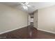 Spacious bedroom with ceiling fan and access to another room at 1663 S Boulder St, Gilbert, AZ 85295