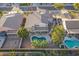 Aerial view of the house, pool, and surrounding neighborhood at 1663 S Boulder St, Gilbert, AZ 85295