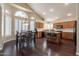 Bright kitchen featuring wood cabinets, an island, and breakfast nook at 1663 S Boulder St, Gilbert, AZ 85295