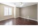 Light and airy bedroom with ceiling fan and window shutters at 1663 S Boulder St, Gilbert, AZ 85295