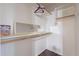Well-lit closet with hanging rods and a mirror at 1663 S Boulder St, Gilbert, AZ 85295