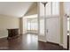 Living room features hardwood floors, bay window with shutters, and a dark wood cabinet at 1663 S Boulder St, Gilbert, AZ 85295